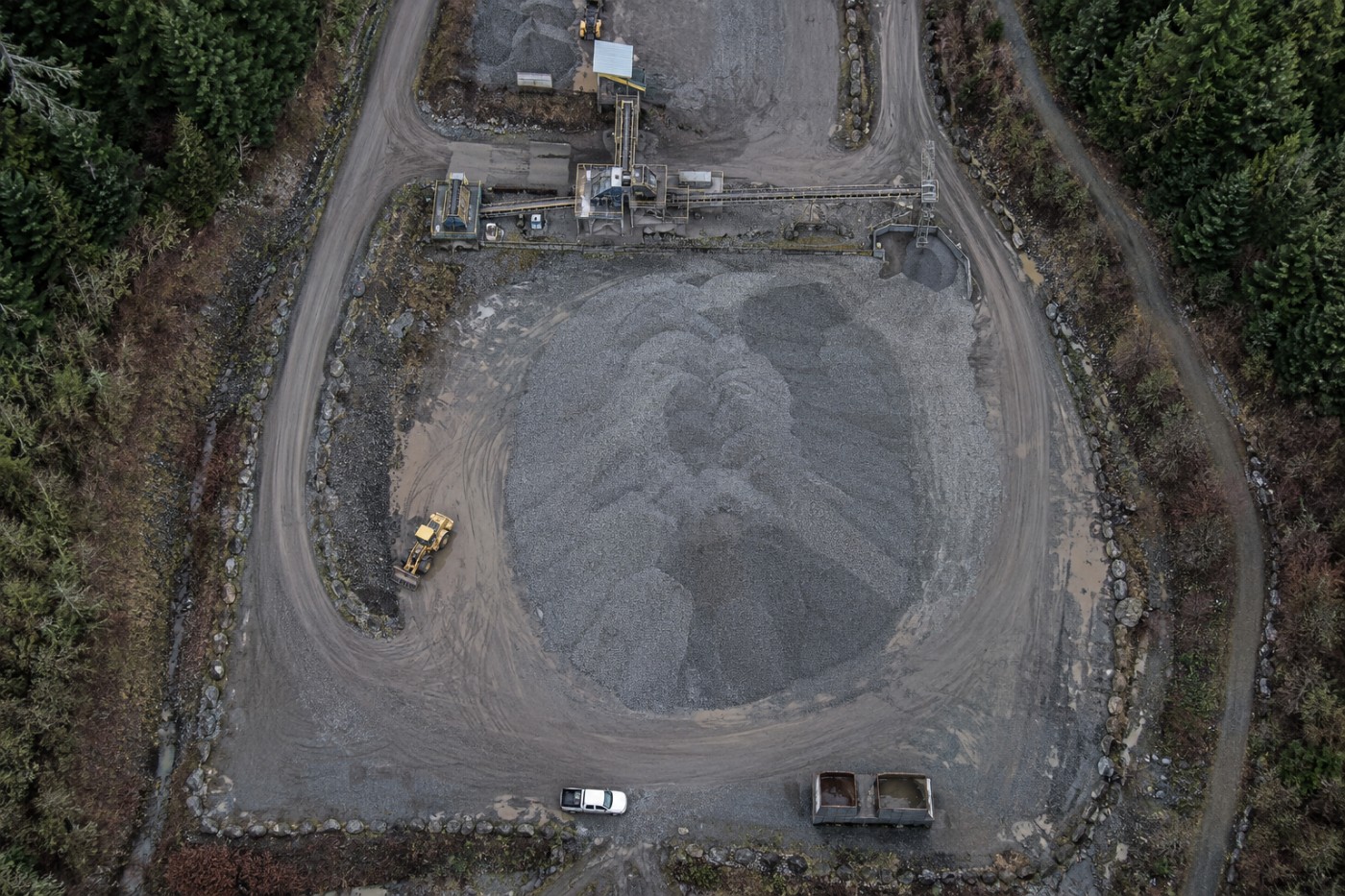 Aerial view of a full aggregate stockpile at a Vancouver Island pit