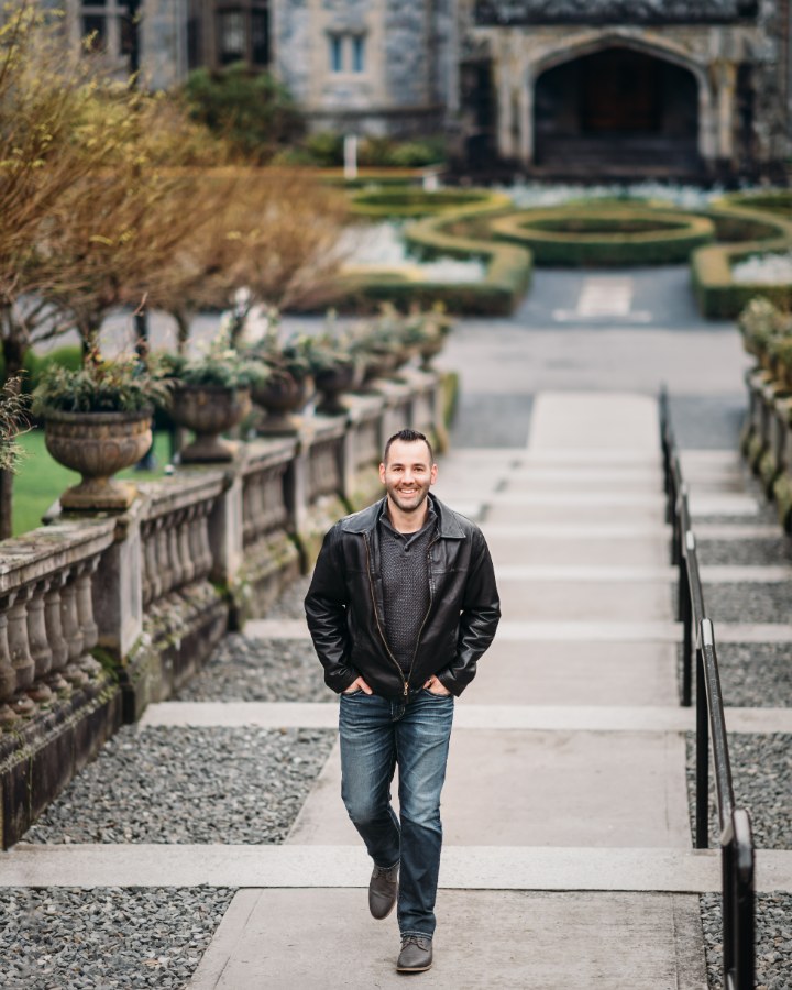 David Olivier, founder and RPA pilot, standing on a garden path at Hatley Castle in Colwood, British Columbia
