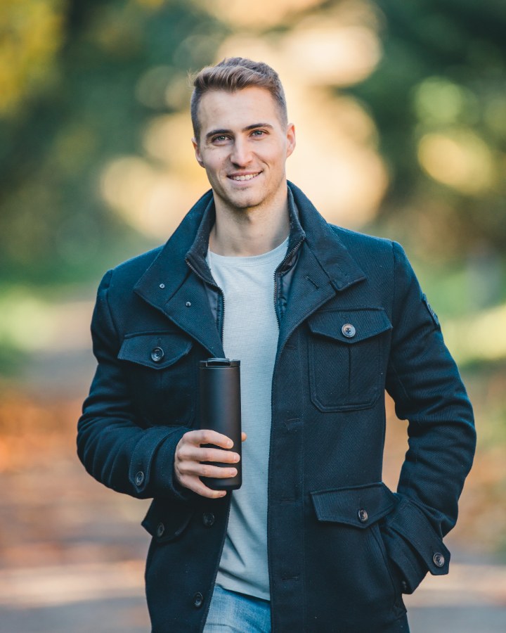 Jonathan Stinner, RPA pilot and camera operator, outdoors in autumn light